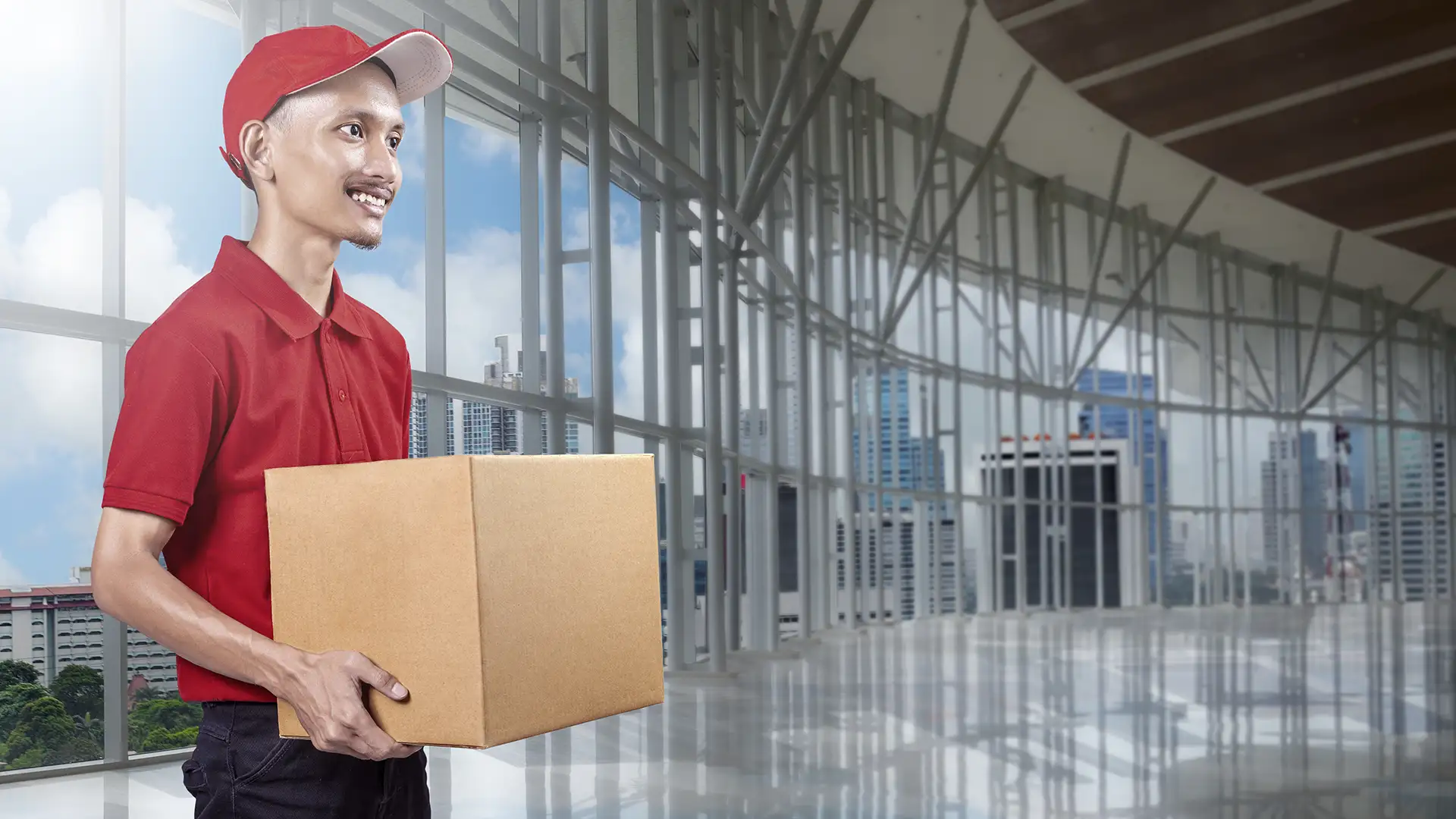 parcel-delivery-man-with-hat-carrying-package